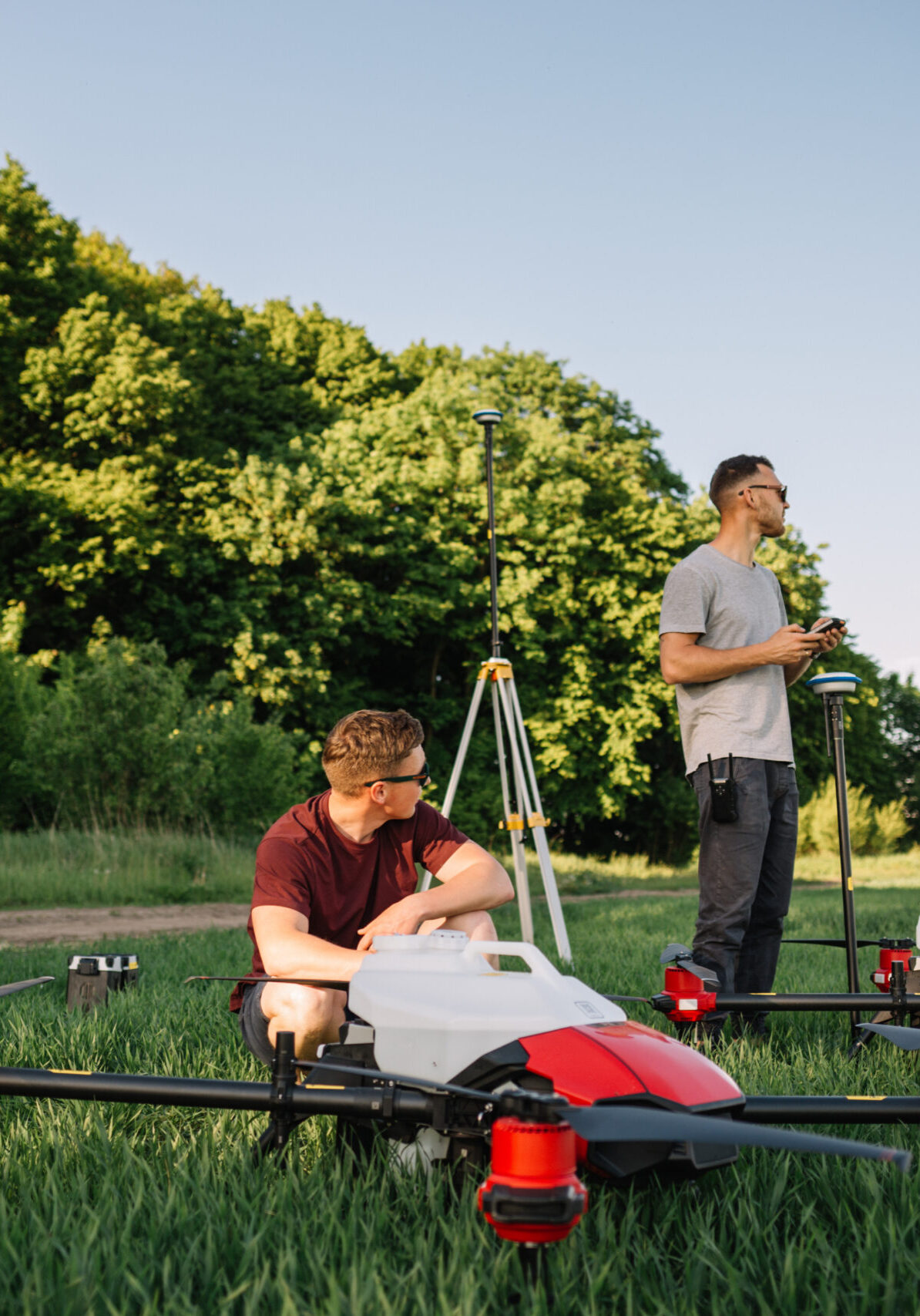 farmers set up agricultural drones before cultivating the fields. farmers set up agricultural drones before cultivating the fields
